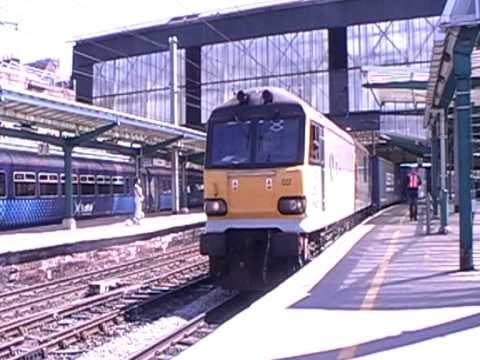 92037 'Sulivan departs Carlisle Station working 4S43 Rugby - Mossend 'Tesco Express' [02/05/2011]