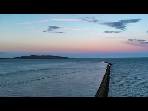 Sunset Flight Over Poolbeg Lighthouse and The Great South Wall in Dublin
