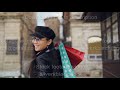 Slow Motion Portrait Of Attractive Asian Girl Walking In The Street With Shopping Bags Turning