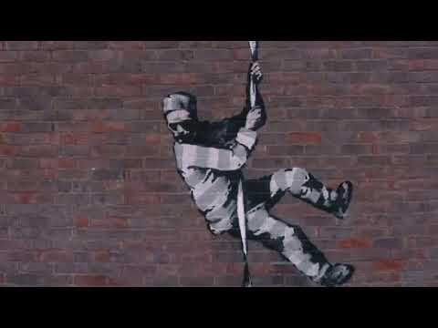Banksy at work: Black hoodie, head torch, paint and freedom