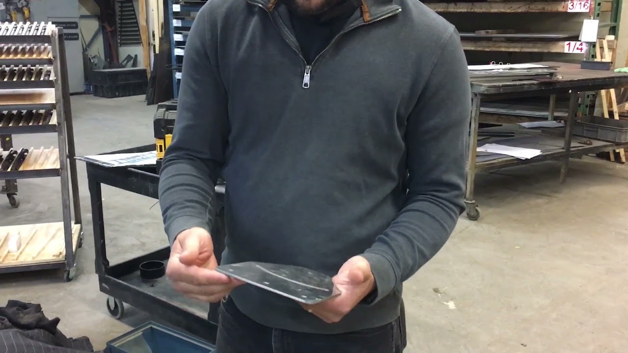 Deburring waterjet cut stainless parts on belt sander