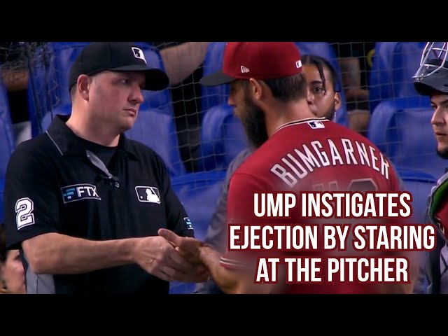 Umpire stares at Bumgarner while massaging his hand, a breakdown