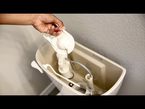 Part of a video titled Pro Tip: How to replace a toilet flapper valve - YouTube