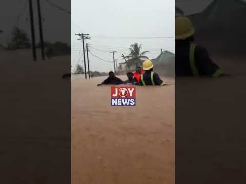 Anyaa Fire officers rescue flood victims and help residents to safety.