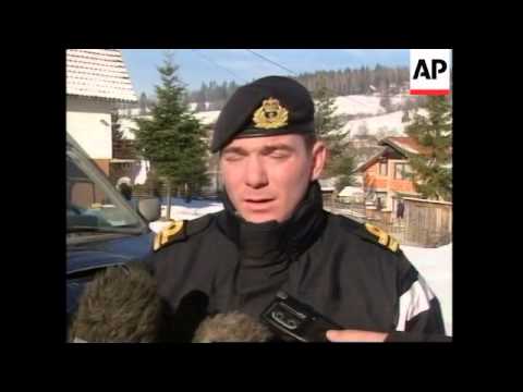 NATO-led troops search house in hunt for Karadzic