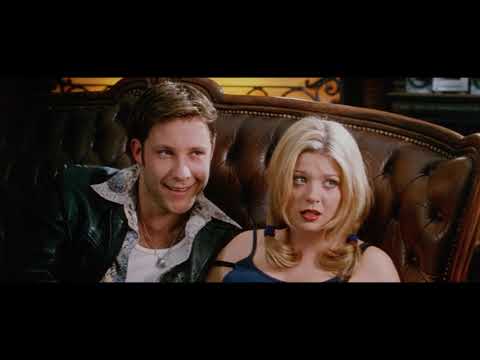 Urban Legend 1998 official trailer still: rain-lashed windshield and campus sign foreshadowing, 90s alt-rock ambience