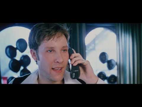 Key pairing: rain-soaked windshield during the gas-station prologue as a famous power ballad plays on the car radio