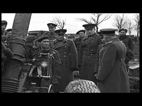 Soviet Officers visit British artillery unit, where they are shown British guns a...HD Stock Footage