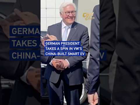 German president takes a spin in VW's China-built smart EV