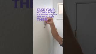 Use a kitchen fork to perfectly hang a photo frame in your home