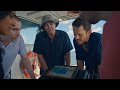A video overview of the project, showing researchers and engineers conducting field work in the southern Great Barrier Reef.  The video shows the AI model detecting underwater imagery of crown-of-thorn-starfish, and footage of researchers analysing the imagery on a screen on the boat.
