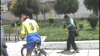 Two Bolivian amputees  walking and riding a bicycle