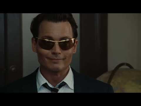 Trailer close-up — Kemp at a typewriter, brass curling around the keystrokes like cigarette smoke