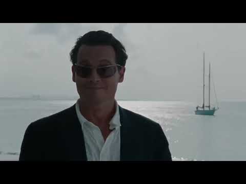 The Rum Diary official trailer still — Kemp in sun-bleached San Juan streets with horns and hand-drums flickering underneath