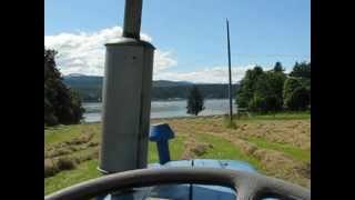 preview picture of video 'Ford 3000 raking hay into windrows on Denman Island.'