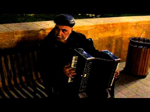 Street musician, playing garmon in Baku, Azerbaijan 16th March 2011