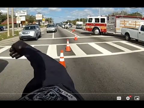 Police Impersonator Jeremy Dewitte Stops to Direct Traffic Like He is Helping the Fire Department