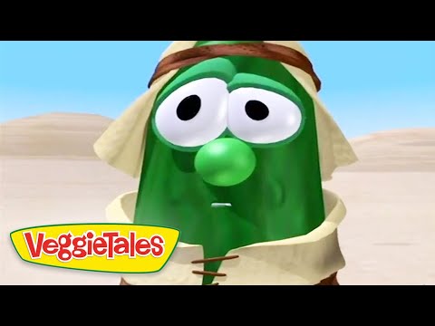 Animated green cucumber character in desert robes with a surprised expression; VeggieTales logo in the corner.