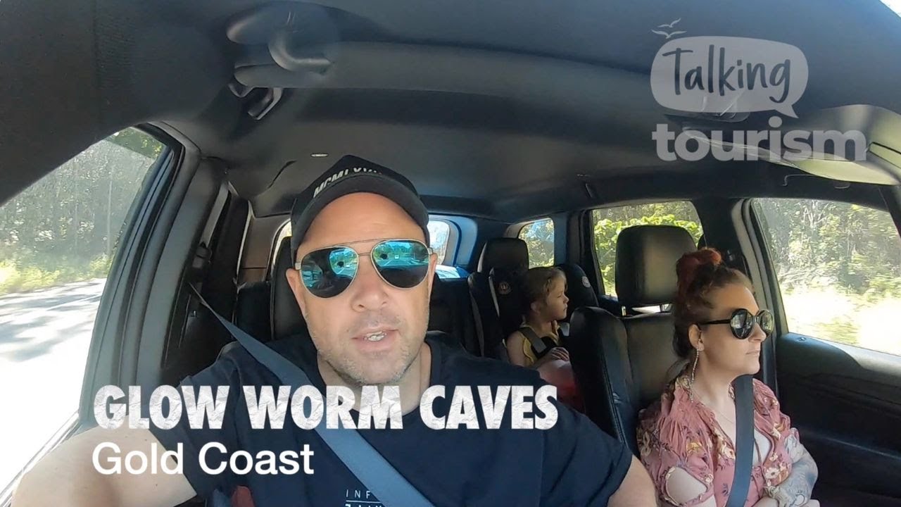 A family explores Tamborine Mountain Glow Worm Caves.
