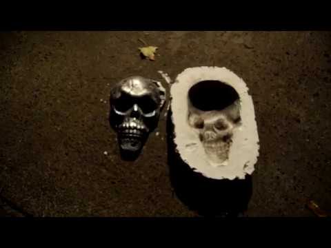 Casting an aluminum skull at night.