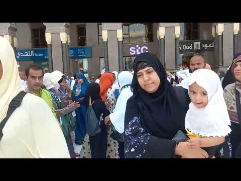 Pilgrimage to Mecca. Performing "Tawaf" during  Umrah. and crowd leaving & street views.