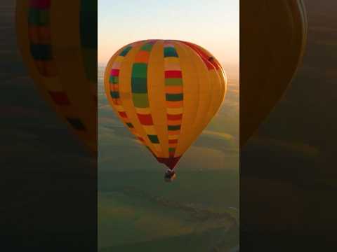 Cyclist becomes first person to ride on top of a hot-air balloon