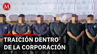 What happened to the 11 police officers who worked for the Jalisco Cartel in Michoacán?