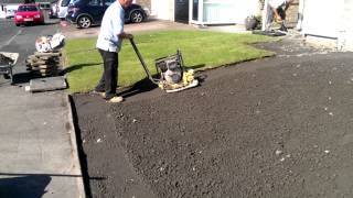 Album cover: video of concrete base going in