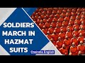North Korea Soldiers March In Orange Hazmat Suits Oneindia News