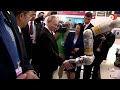 Putin shakes robotic hand at Chinese university | REUTERS