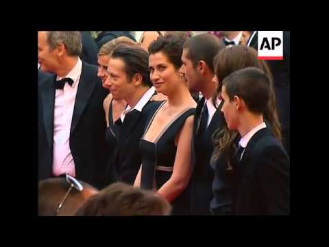 The stars and rain come out for the red carpet arrivals for Un Conte de Noel