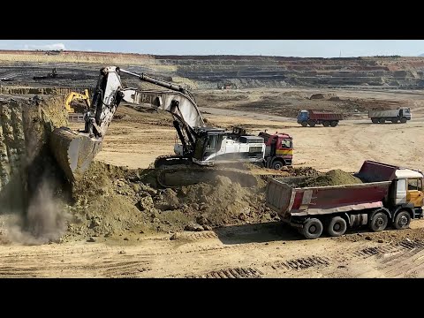 Caterpillar 375 Excavator Loading Mercedes And MAN Trucks