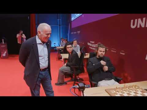 Magnus is late again and Garry Kasparov plays his first move!