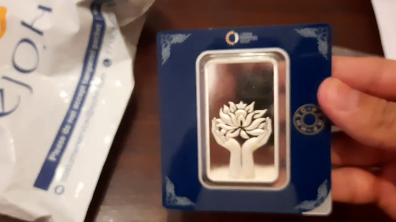Watch video Unboxing MMTC PAMP lotus Silver Ingot Coin/Bar-100 gm from ejohri.com |Experience. Now Unboxing MMTC PAMP lotus Silver Ingot Coin/Bar-100 gm from ejohri.com |Experience.