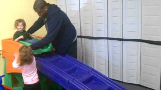 baby riding toddler roller coaster - daycare