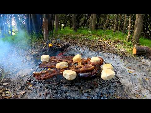 Fishing for tarariras on the shore of the stream and cooking barbecued meat outdoors, neighborhoo...