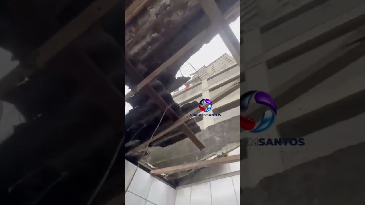 Estrutura de construção desaba sobre casa vizinha e deixa idosa ferida no Aviação, em Praia Grande.