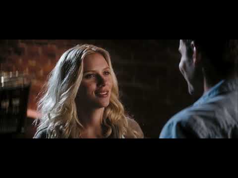 Official trailer still: ensemble cast framed in Baltimore interiors, pop-song palette implied