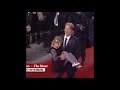 Mads Mikkelsen carrying his young co-star up the stairs at Cannes