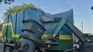 City of Fresno Peterbilt heil side loader picking up the green waste can