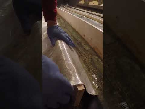 Wrapping boat stringers with fiberglass mat