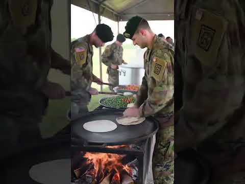 US Army Field Kitchen in Action: Teamwork on the Frontlines"
