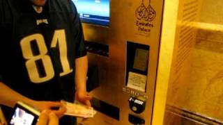 Buying gold in a vending machine in Abu Dhabi at Emirates palace!
