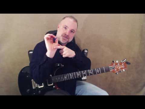 How To Hold The Electric Guitar