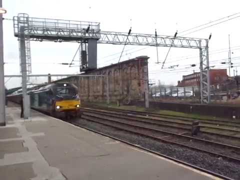 The Class 68 DRS No.68004 'Rapid' with “S.N.W.R.S.T.R. (Outward Leg)” departing at Carlisle.