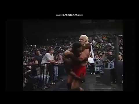 Scott Steiner slams Booker T through table