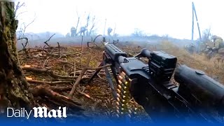 Ukrainian soldiers open fire with machine guns on Russian trenches in Bakhmut POV footage