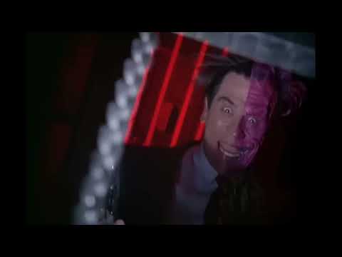 Batman Forever 1995 theatrical trailer still with Batman and villains in neon-lit Gotham
