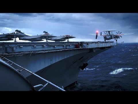 French E-2s and Rafales Super Fighter launch from the Charles de Gaulle for patrols over Romania