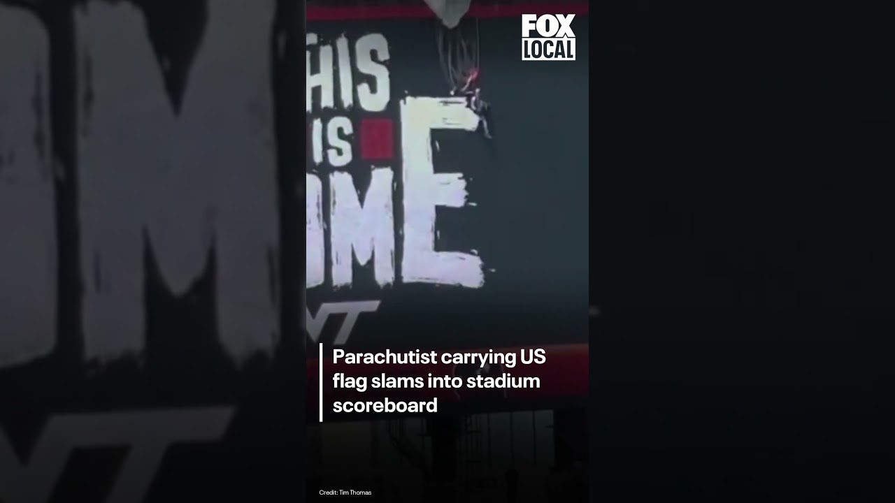Parachutist carrying US flag slams into Virginia Tech stadium scoreboard